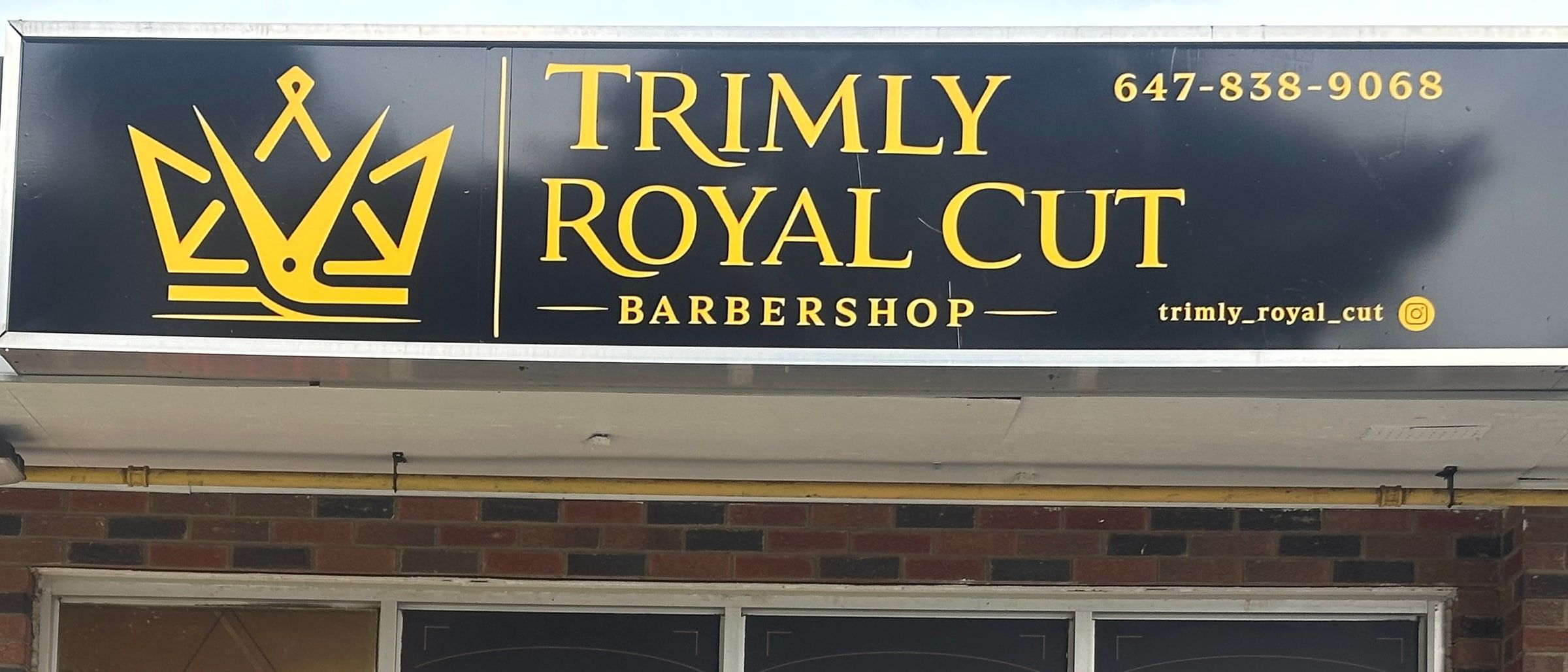The Trimly Royal Cut Barbershop sign